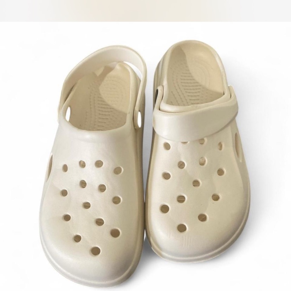 Cream Sandals with Perforated Design and Rotating Heel Strap